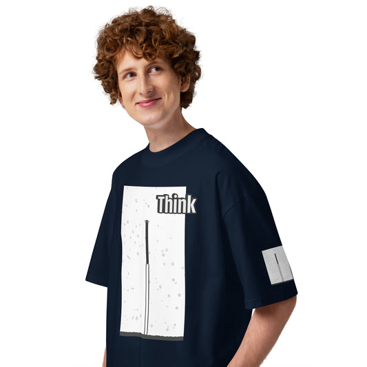 Person wearing a navy blue t-shirt with an abstract long-leg human graphic design on a white background