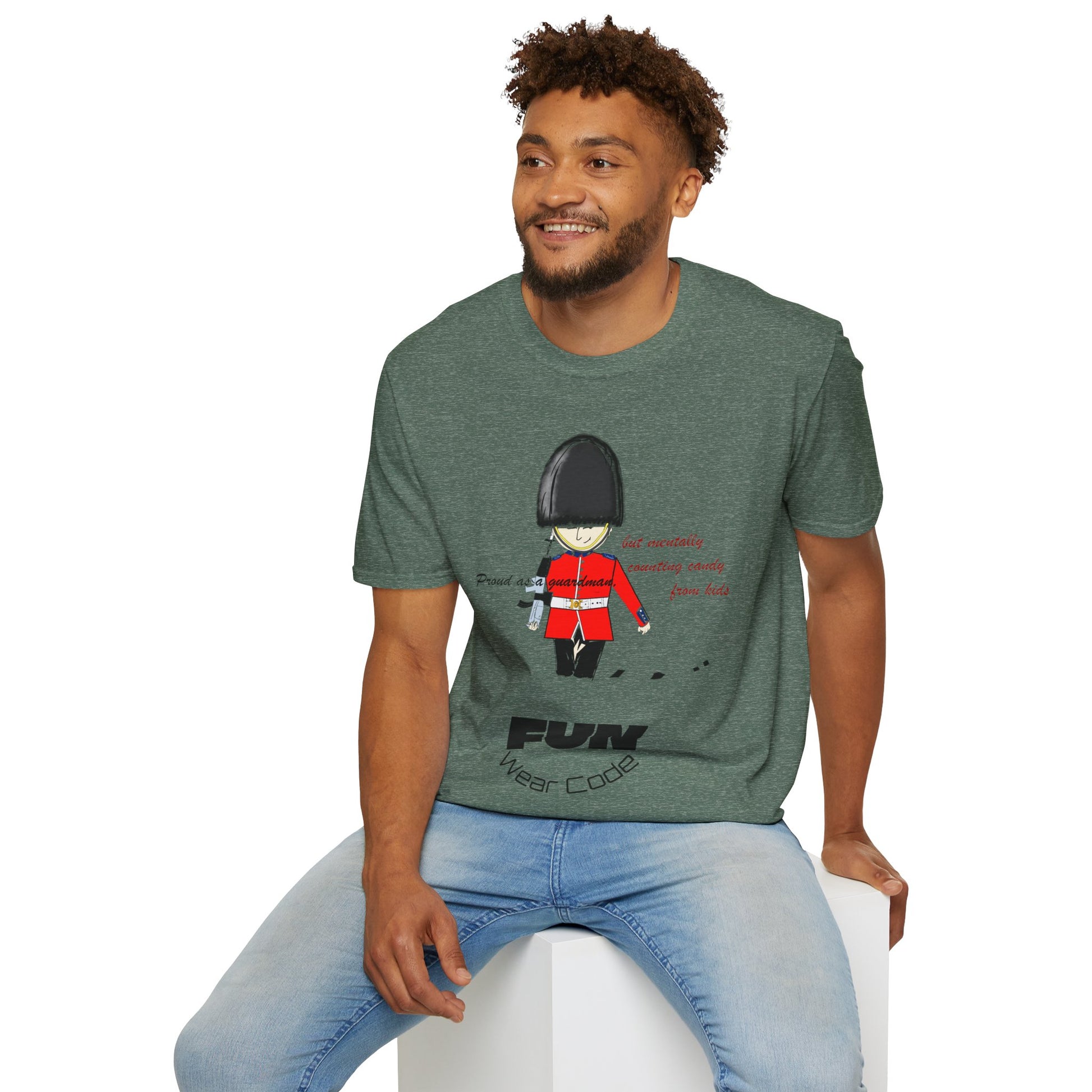 Man wearing a green t-shirt with a royal guardsman graphic design and text 'Fun Wear Code', sitting on a white stool against a white background.