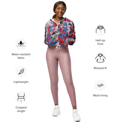 Woman wearing a colorful geometric-patterned hoodie and pink leggings with feature icons on a white background.