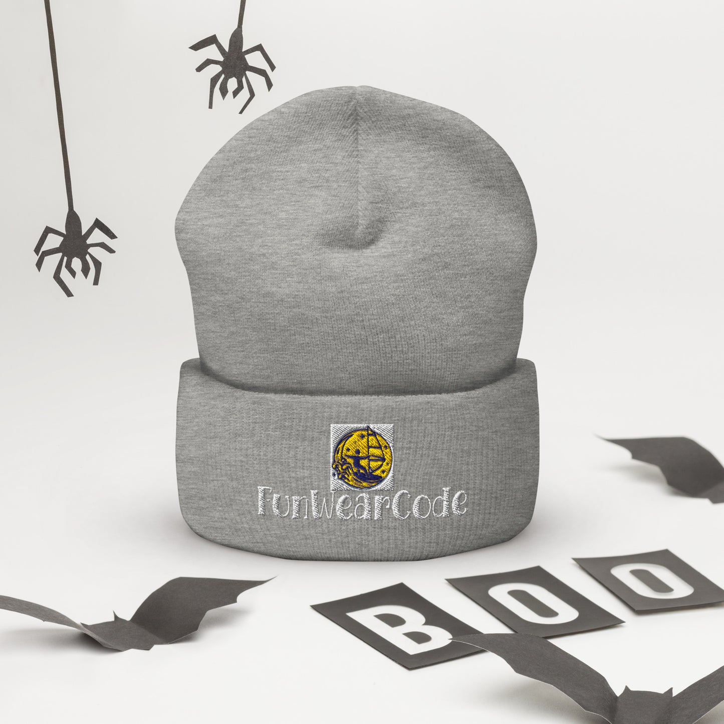 Gray beanie with FunWeardCode logo on a Halloween-themed background with spiders and 'BOO' letters.