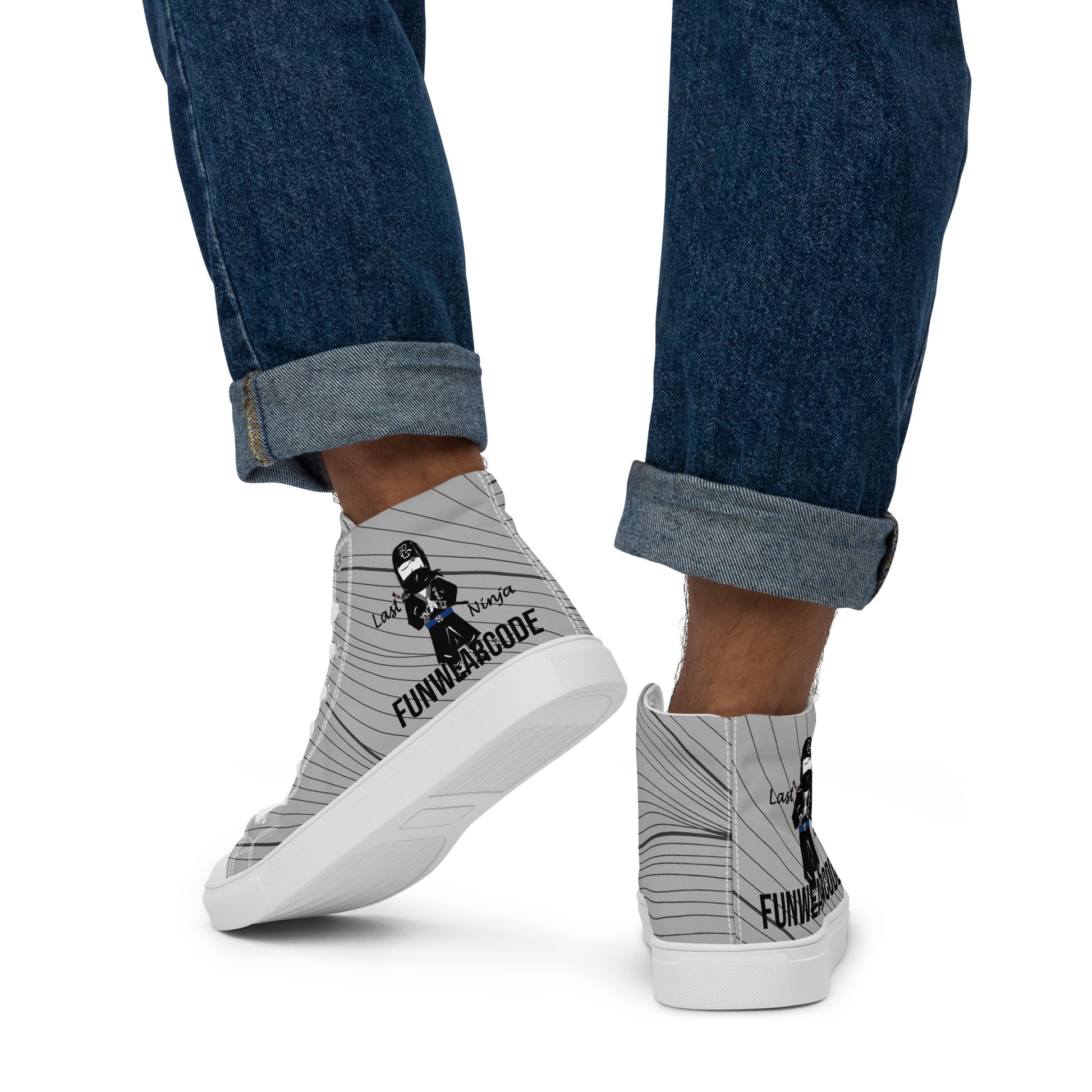 Gray high-top sneakers with a ninja graphic and 'Fun Wear Code' text logo worn with rolled-up blue jeans on a white background