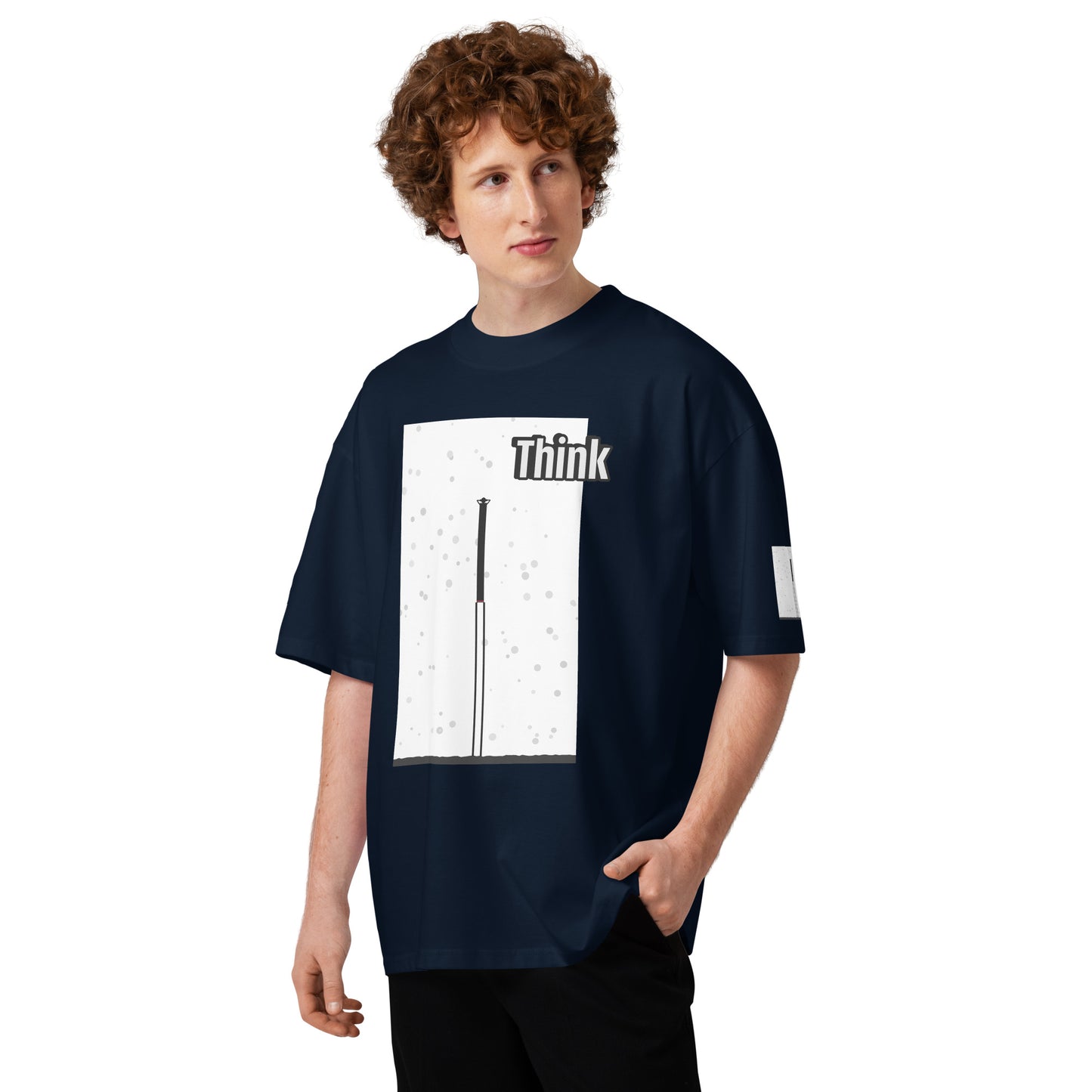 Person wearing a navy blue t-shirt with an abstract long-leg human graphic design and text on a white background
