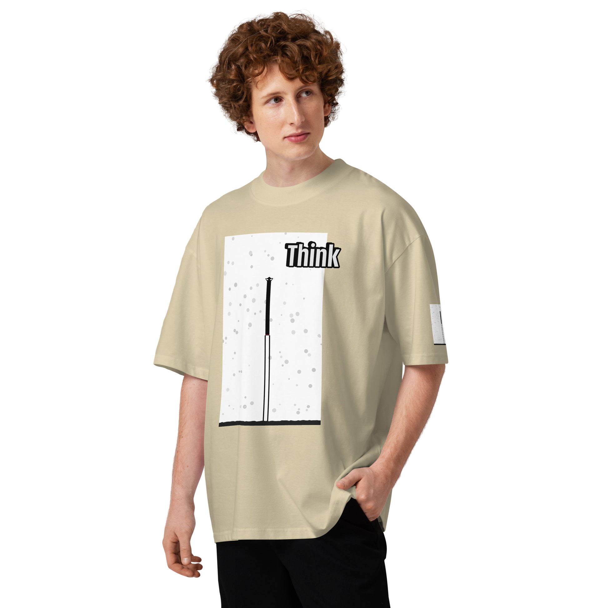 Person wearing a beige t-shirt with an abstract long-leg human graphic design on a white background