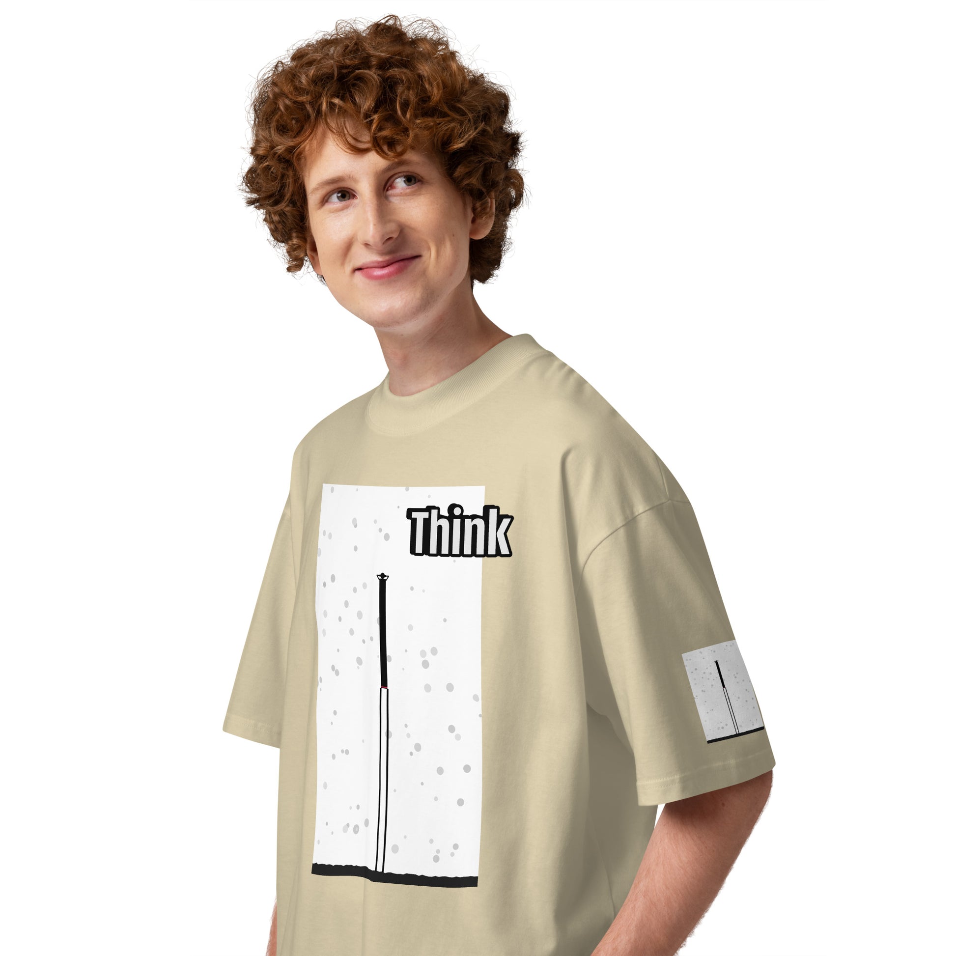 Person wearing a beige t-shirt with an abstract long-leg human graphic design and text on a white background