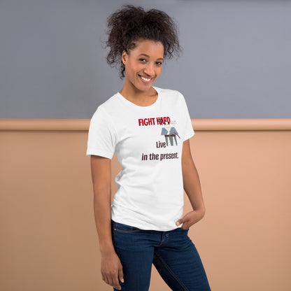 Woman wearing a white t-shirt with a playful samurai graphic and motivational quote, standing against a plain background.
