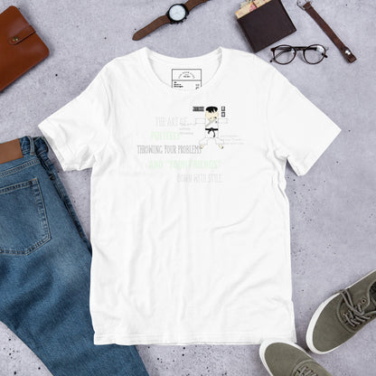 White t-shirt with text and a playful judo graphic on a gray surface with jeans, shoes, and accessories.
