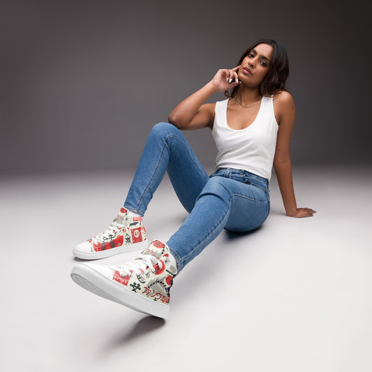 Woman sitting on a gray floor wearing a pair of high-top sneakers with colorful Japanese elements graphic design, and with a ninja graphic and 'Fun Wear Code' text logo, blue jeans, and a white tank top.